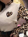 Gilet con cuore maculato i bottoni laterali