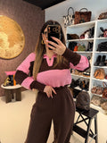Maglione a righe rosa marrone