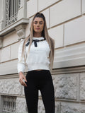 Maglione panna con fiocco nero