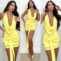 Abito giallo schiena nuda e nodo