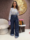 Pantalone con cravatta e risvolto
