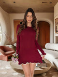Abito bordeaux con gonna a ruota e rouches