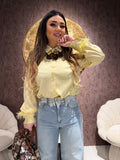 Camicia con dettaglio piume
