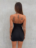 Abito nero con gioiello push up