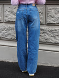 Jeans vita bassa con strappi
