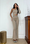 Tuta monospalla beige con oblò