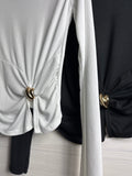 Maglia con fiocco e gioiello oro