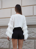 Maglione bianco con frange