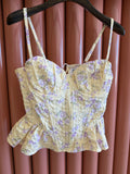 Top bustino con fiorellini giallo pastello