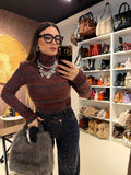 Maglioncino collo alto a righe spalle bombate