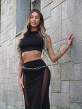 Completo top e gonna nero con trasparenze