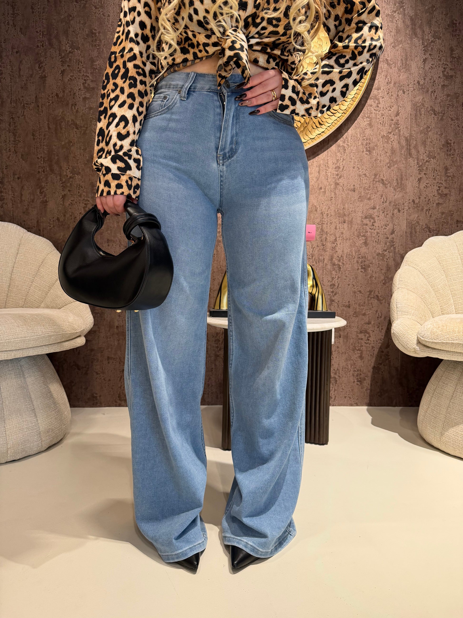 Jeans con tasca glitter maculata