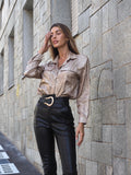 Pantalone in ecopelle con cintura