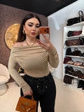 Maglia a maniche lunghe con scollo drappeggiato