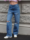 Jeans vita bassa con strappi