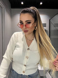 Maglioncino bianco a V con bottoni gioiello