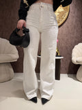 Jeans con brillantini e pizzo bianco