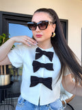 Giacca crop con fiocchi bianco nero