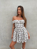 Abito bianco a ruota con fiorellini nude blu