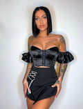 Top nero con maniche in strass