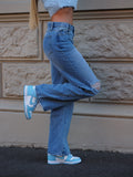 Jeans vita bassa con strappi laterali