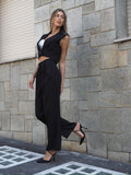 Completo smanicato e pantalone gessato nero