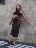 Completo top e gonna nero con trasparenze