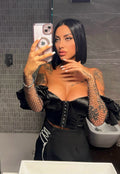 Top nero con maniche in strass
