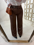 Pantalone con fibbia laterale