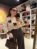 Maglione con fiocchi