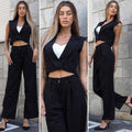 Completo smanicato e pantalone gessato nero
