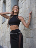Completo top e gonna nero con trasparenze
