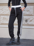 Pantalone sportivo con righe bianche