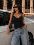 Top drap con gioiello