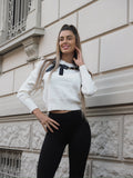 Maglione panna con fiocco nero