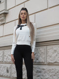 Maglione panna con fiocco nero