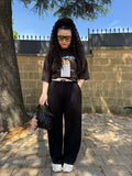 Pantalone nero banda beige
