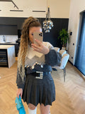 Maglione grigio con maxi paillettes