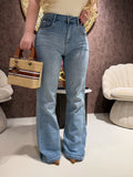 Jeans con borchie e dettaglio maculato sul retro