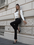 Maglione panna con fiocco nero