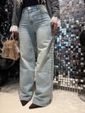 Jeans con borchie laterali