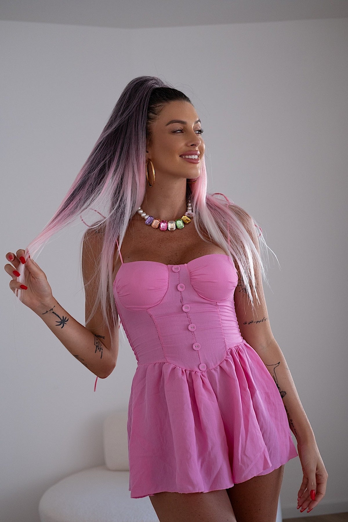 Tutina rosa con bottoncini