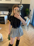 Maglioncino crop nero a trecce con strass