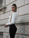 Maglione panna con fiocco nero