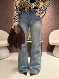 Jeans con borchie e dettaglio maculato sul retro
