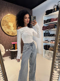 Blusa monospalla drappeggiata