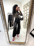 Pantalone in ecopelle con frange