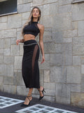 Completo top e gonna nero con trasparenze