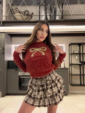 Maglioncino mattone con fiocco oro