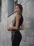 Completo top e gonna nero con trasparenze